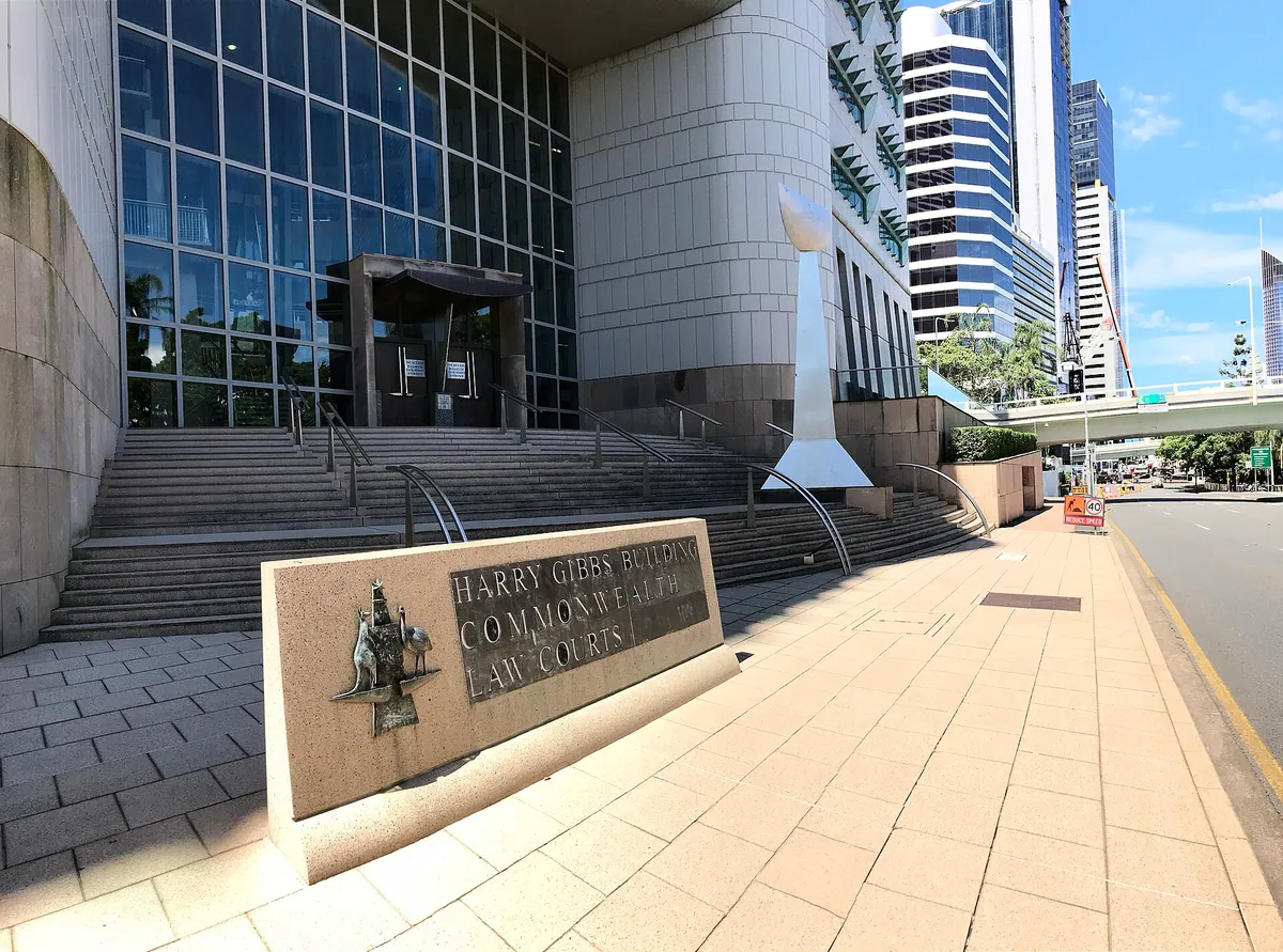 Entrance steps and name sign of the Harry Gibbs Commonwealth Law Courts Building on North Quay, Brisbane